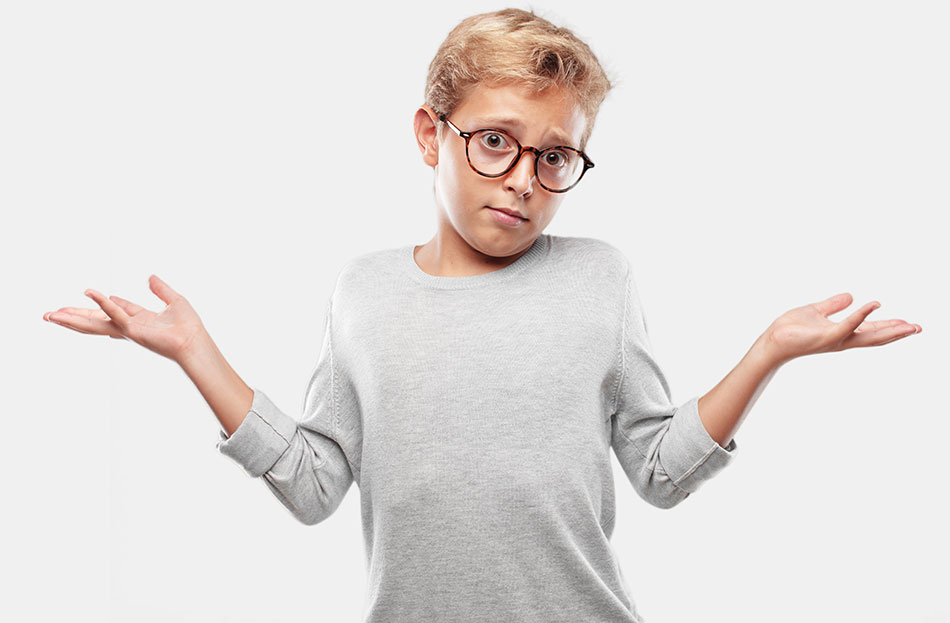 Boy with glasses wondering about contacts for kids