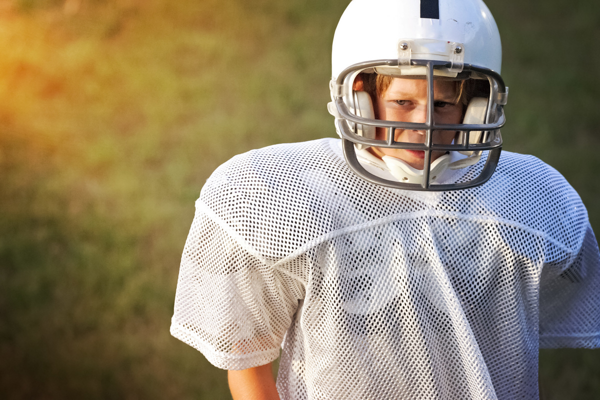 boy wearing football gear