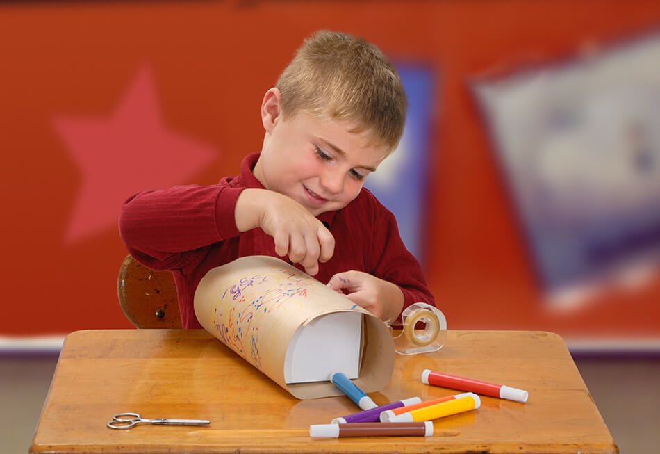 Child wrapping homemade gift