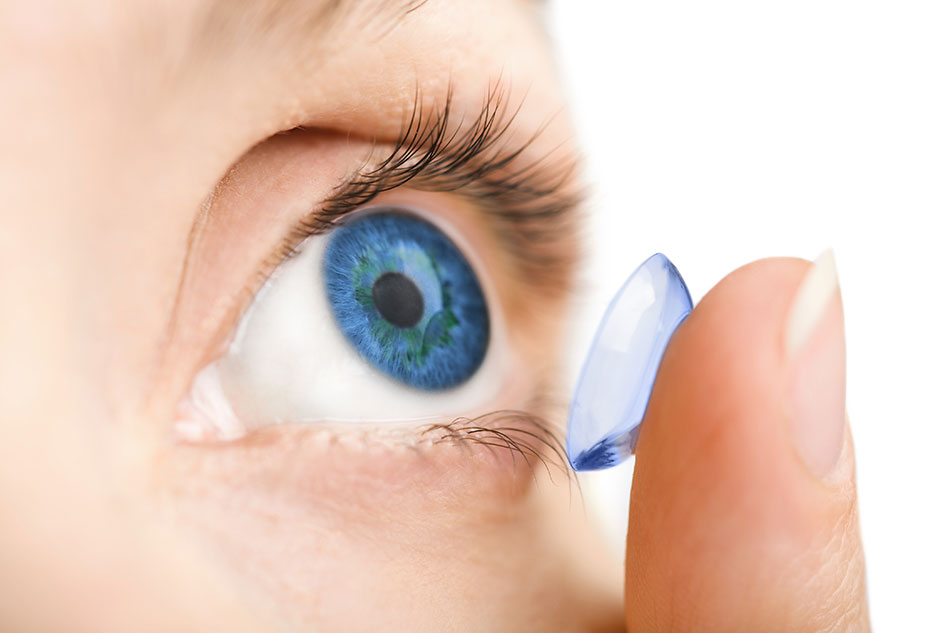 close up of blue eye with contact lens