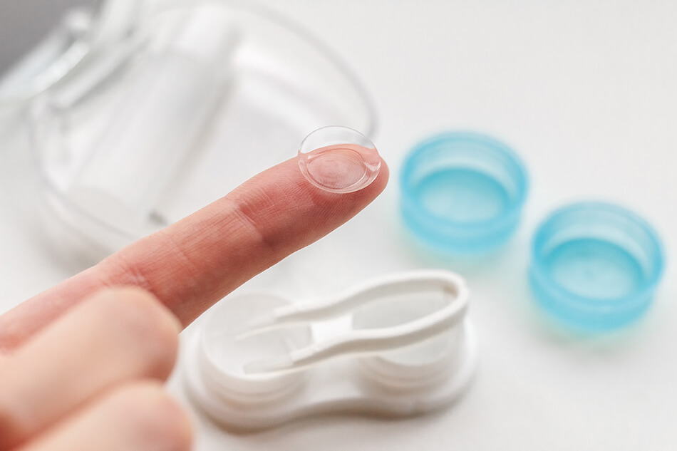 contact lens on fingertip