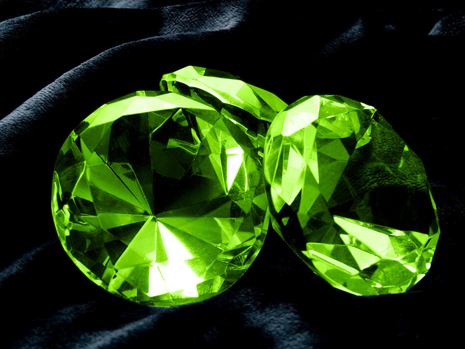 Emeralds on black cloth