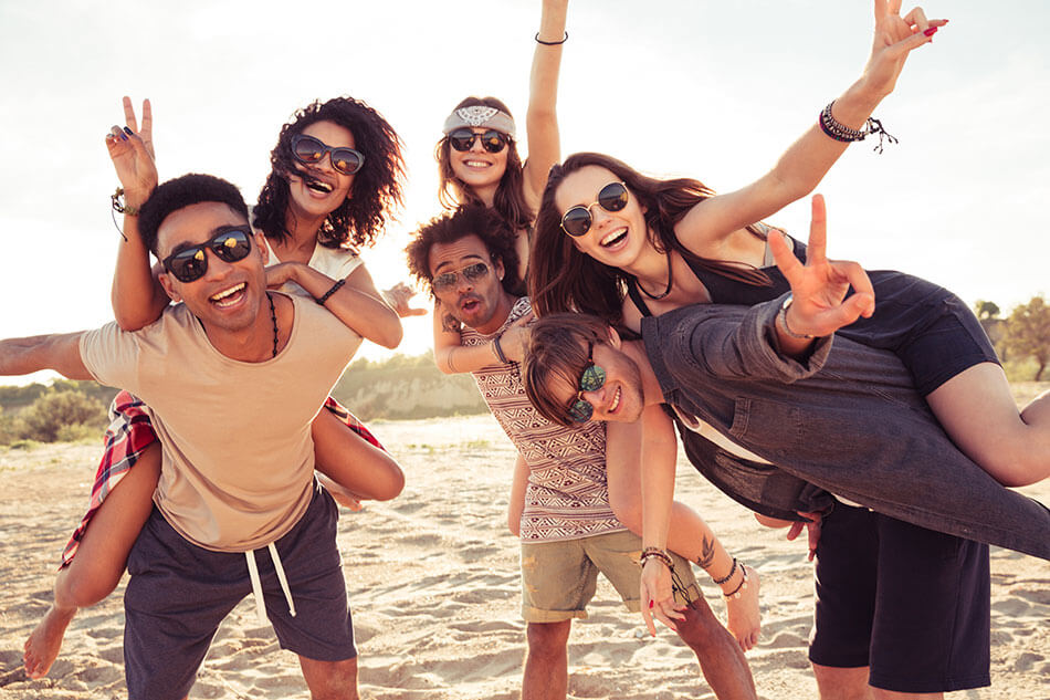 Diverse Group of Friends having fun on the beach