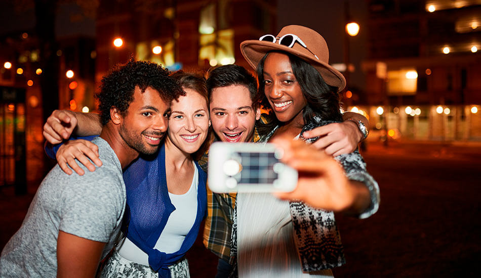 Diverse perfect friends taking Instagrammable travel selfie