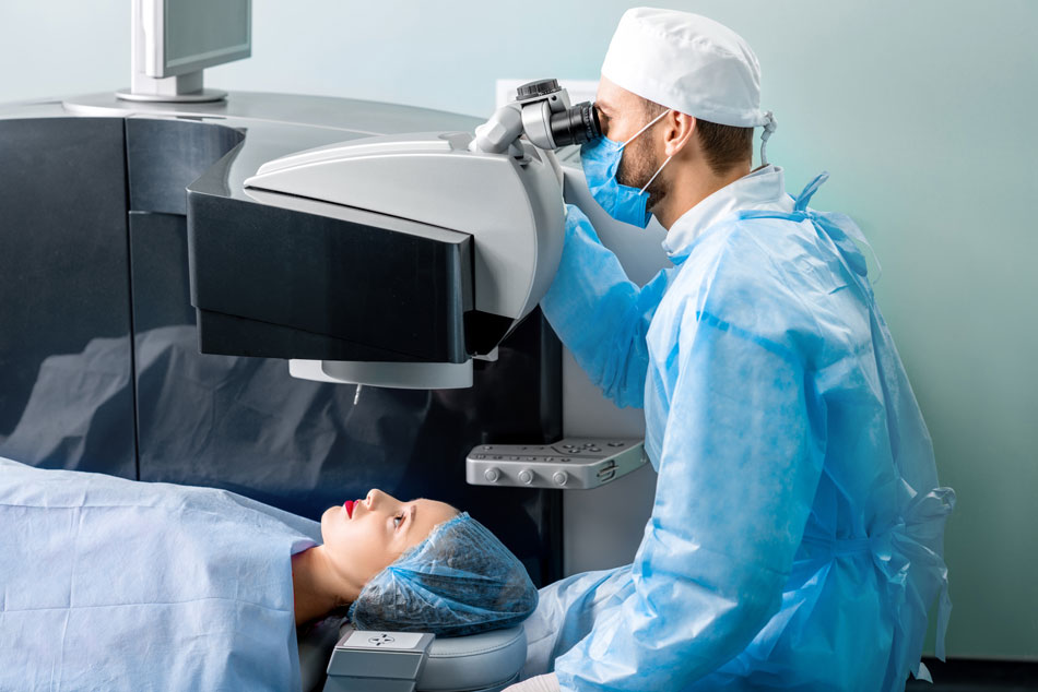 Female patient getting laser eye surgery by male doctor