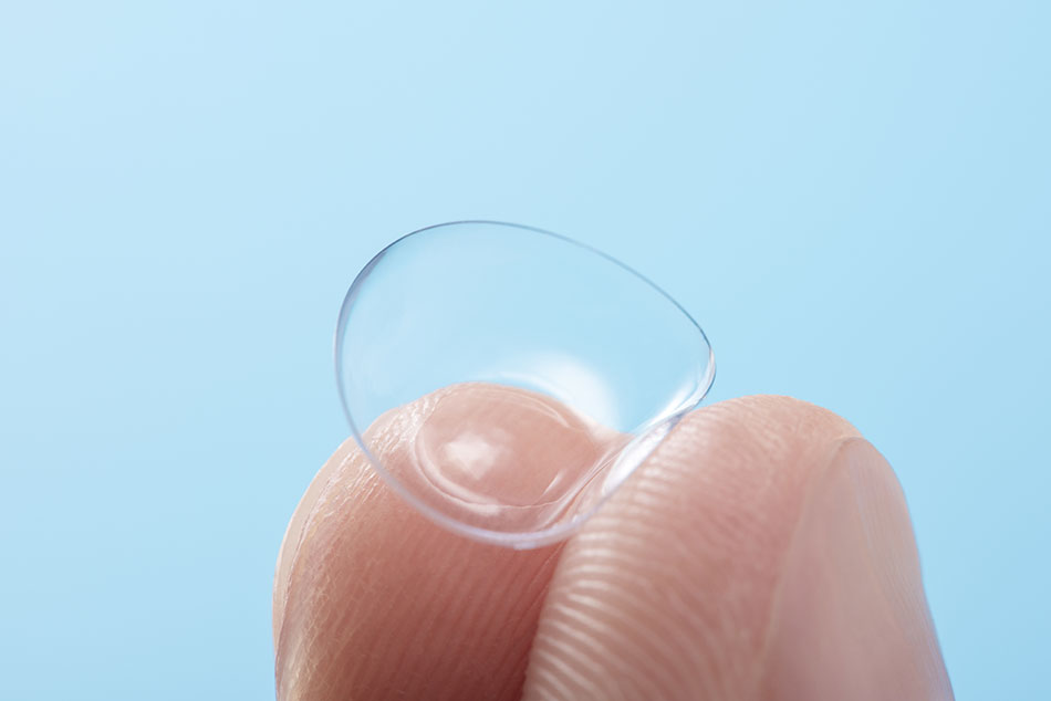 fingers bending soft contact lenses