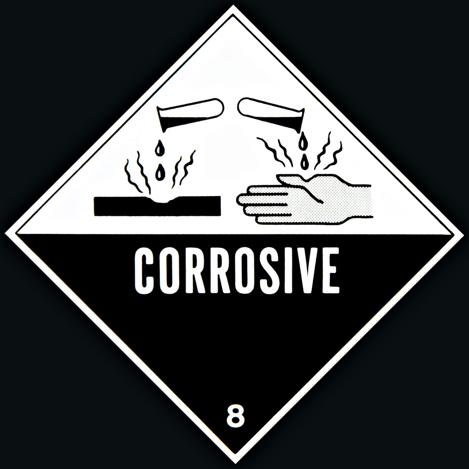 Graphic sign saying CORROSIVE