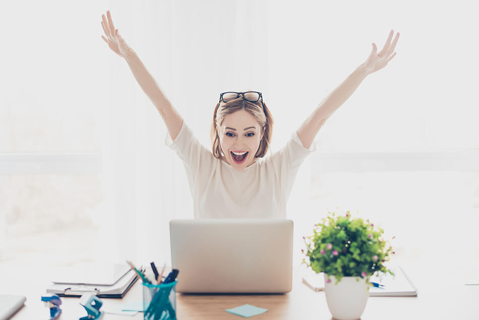 Happy young woman with laptop, shopping back-to-school sales