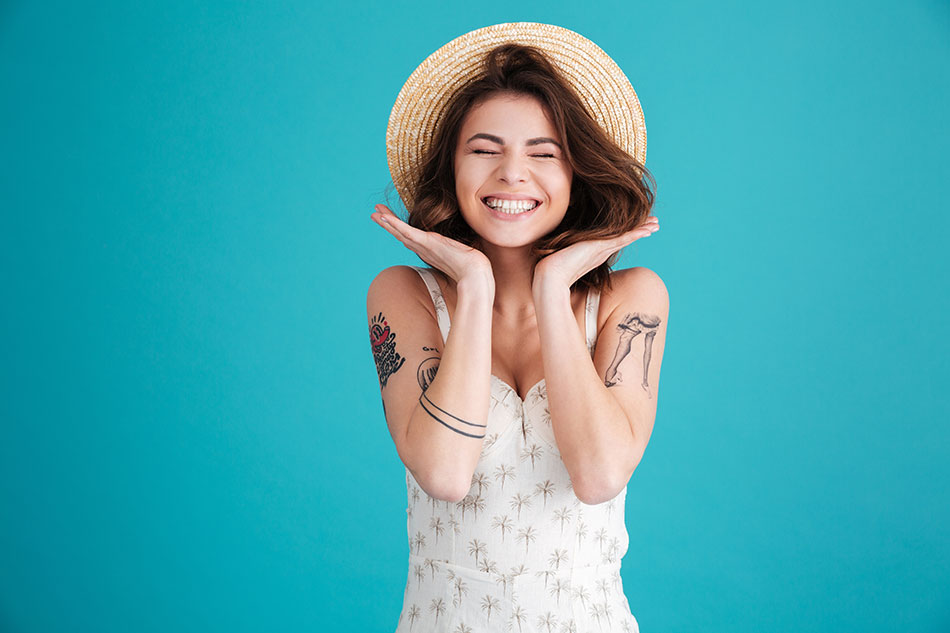 happy woman in straw hat, blue background