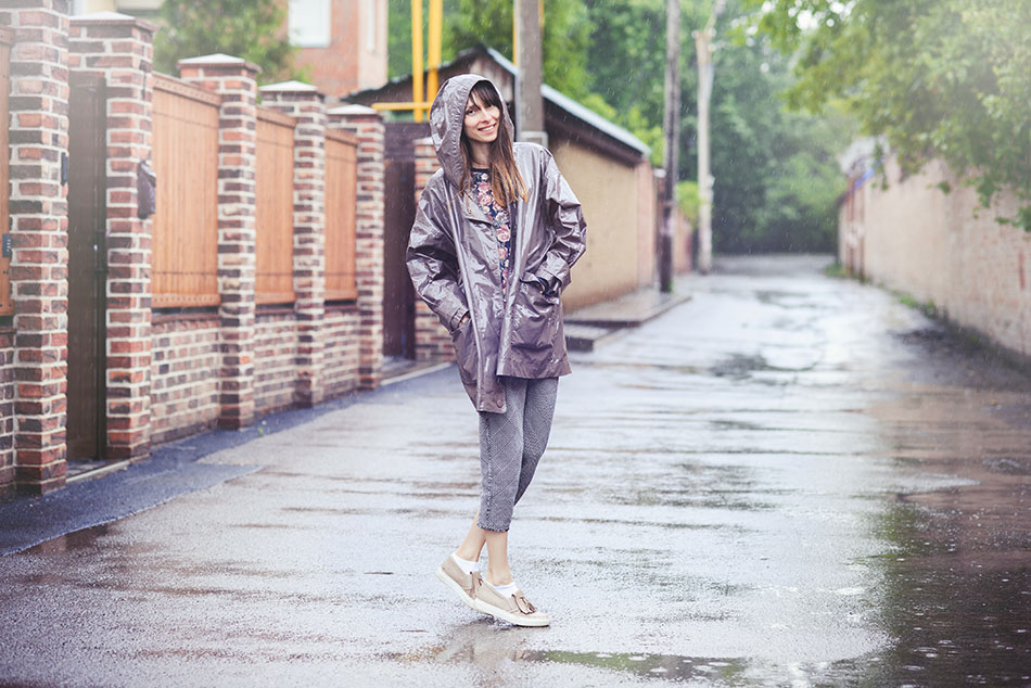 happy woman walking in the rain