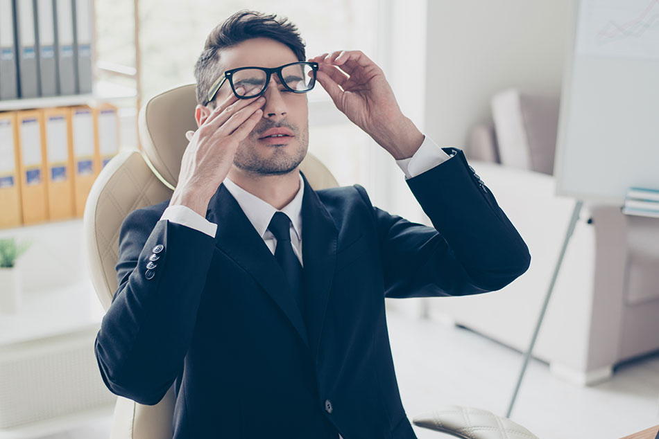 man in office with dry eyes