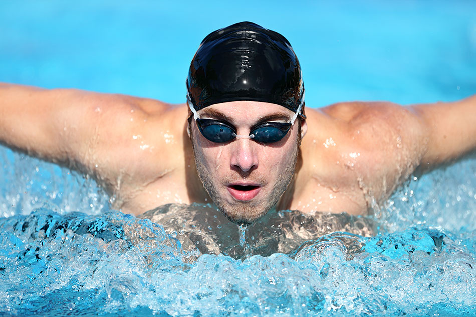 man swimming with goggles for eye care