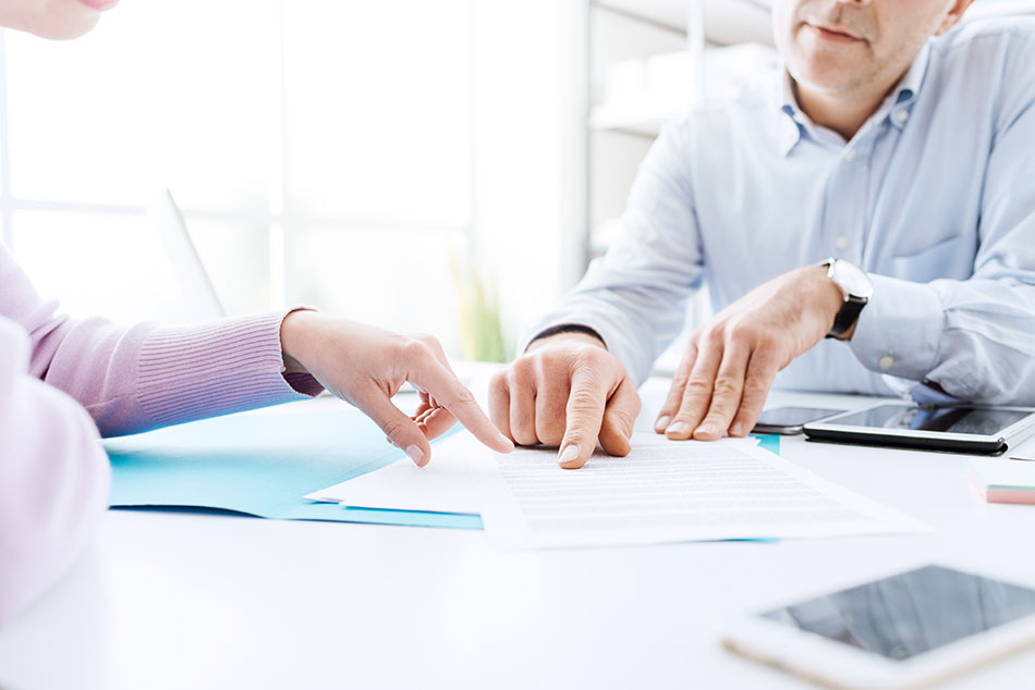 man and woman going over insurance policy