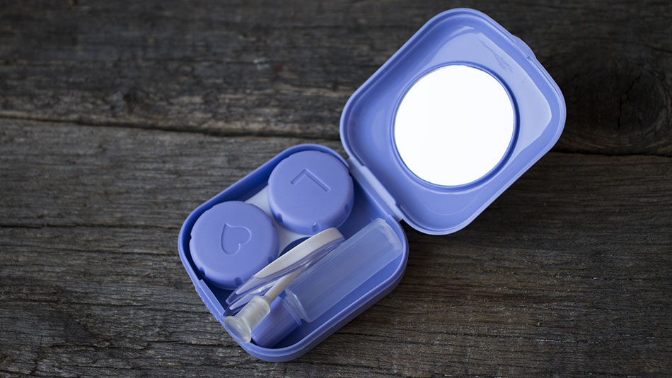 monthly contact lenses care case with eye drops and tweezers