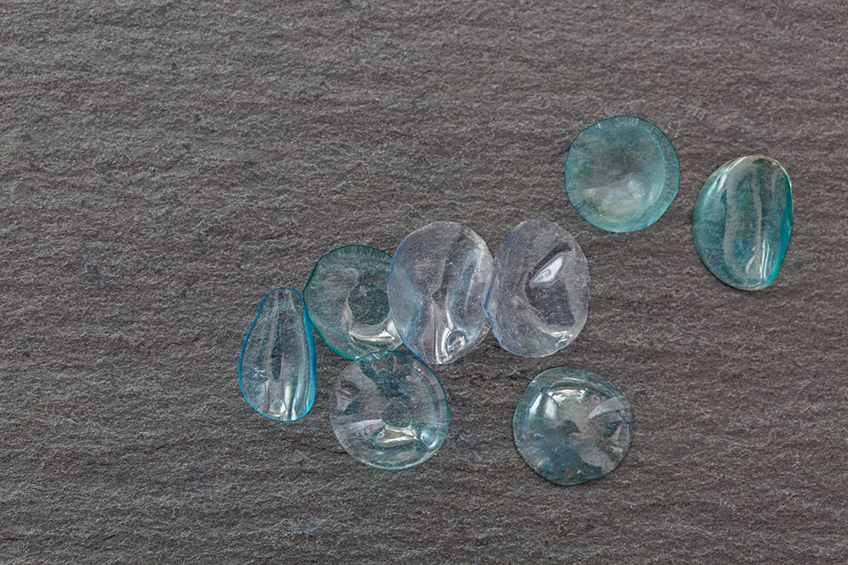 old daily disposable contact lenses on floor