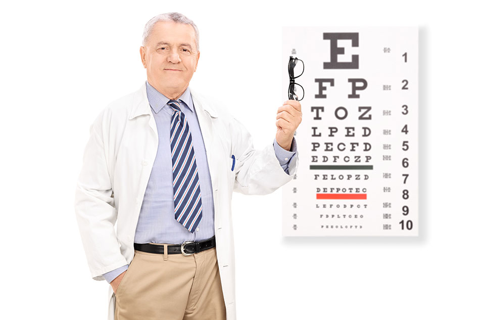 optometrist holding glasses in front of eye chart