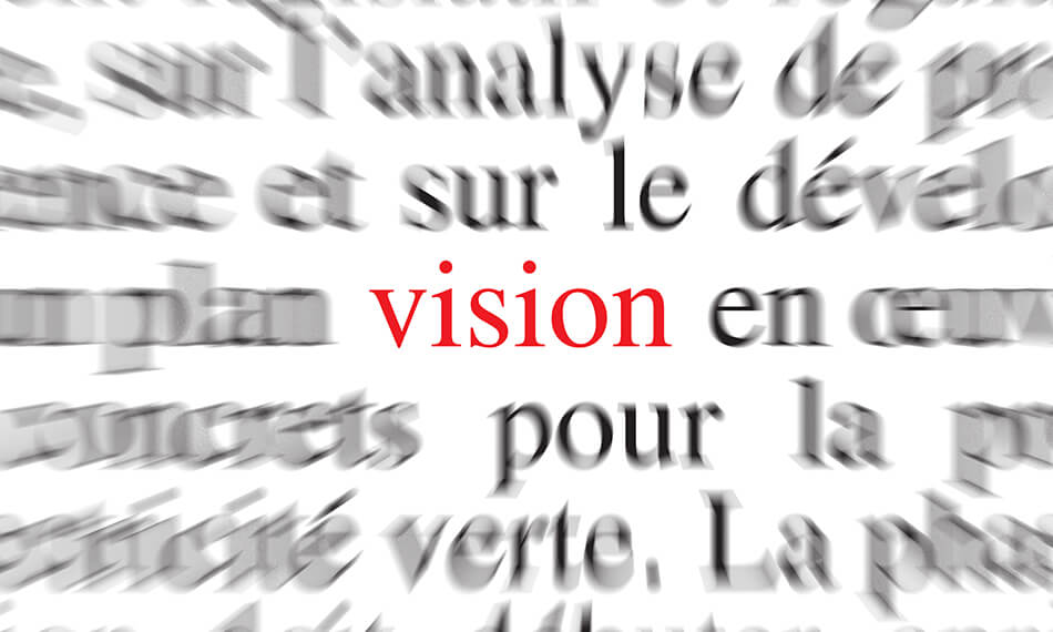 the word vision in red on a blurry background