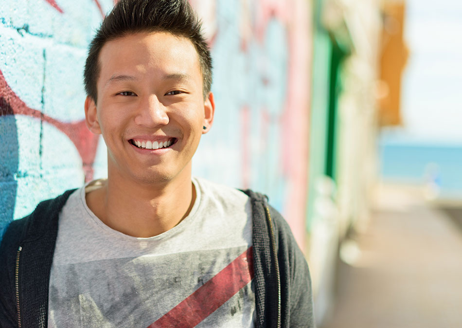 smiling Asian man with healthy eyes