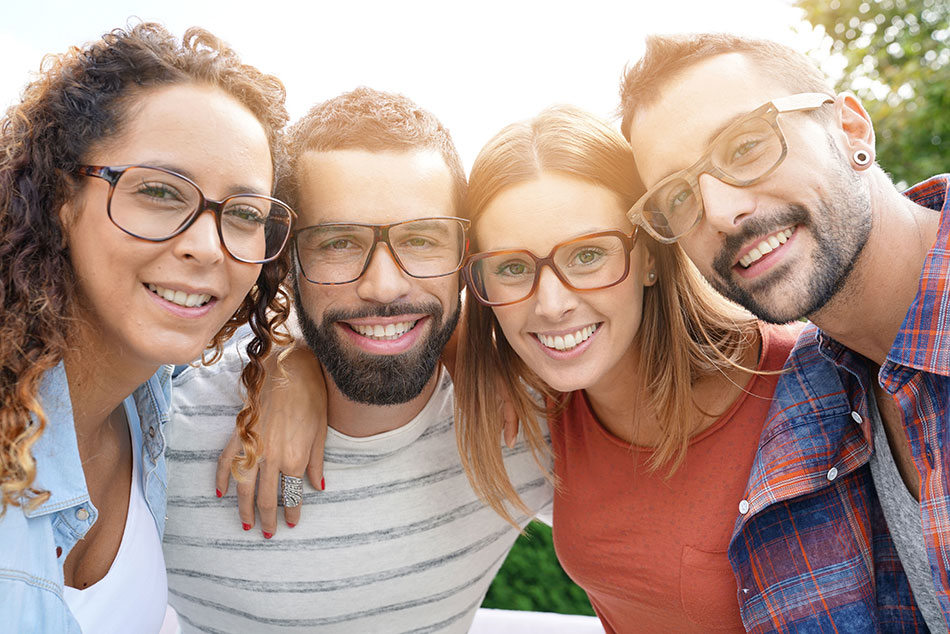 smiling friends wearing eyeglasses