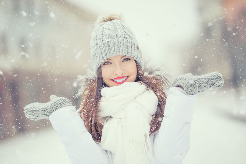 Smiling woman outside in winter