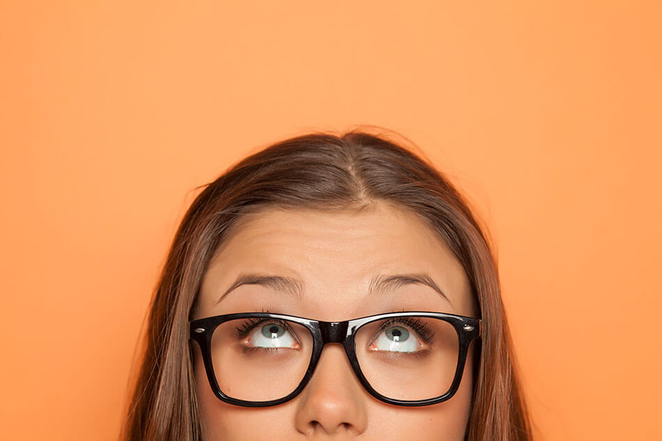 teen girl wearing glasses thinking about contacts