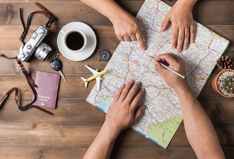 trip planning with map coffee and photo camera