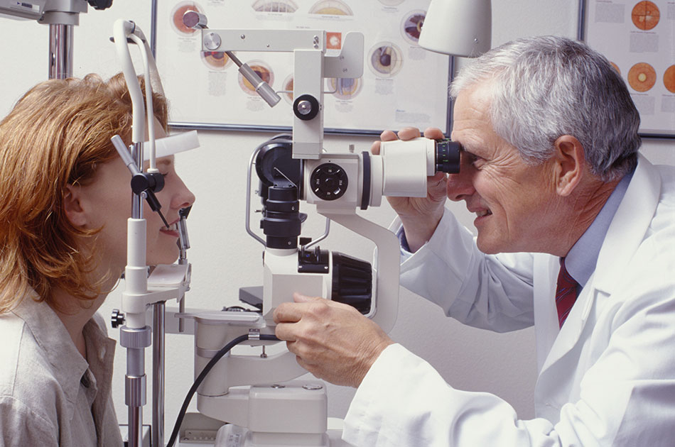 woman at eye doctor appointment getting examined