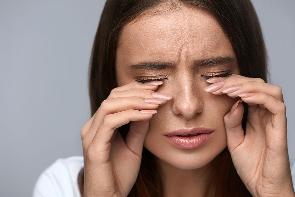 woman with eyes irritated from contacts