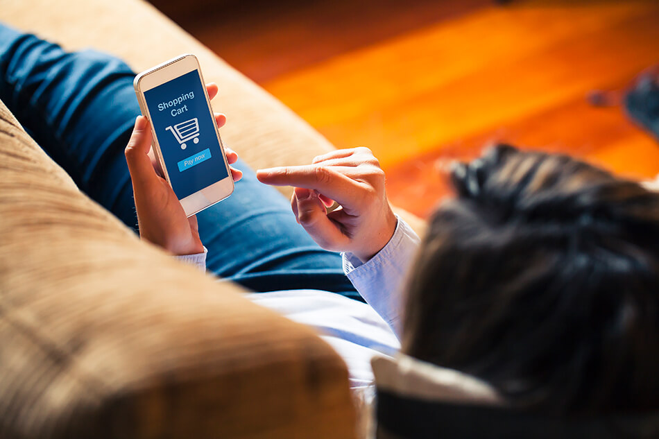 Woman shopping online from her mobile phone