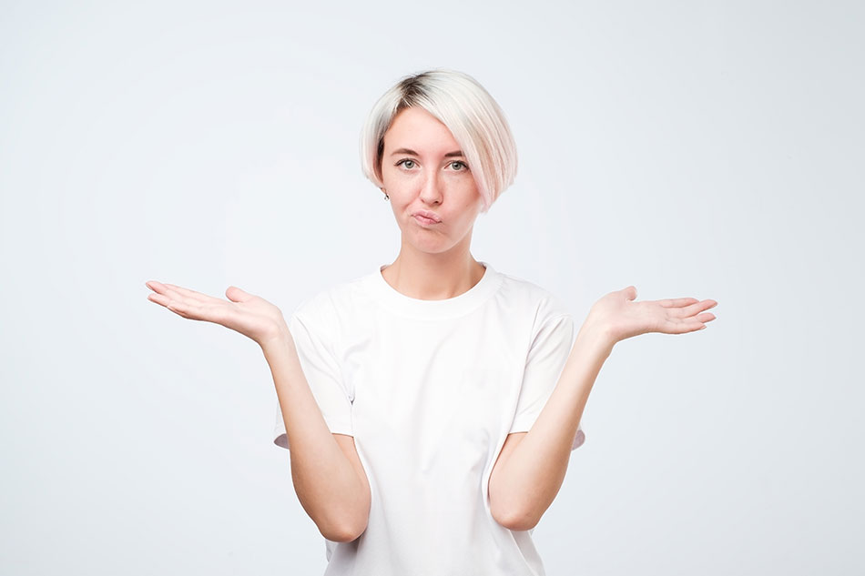 woman shrugging shoulders and palms up in question