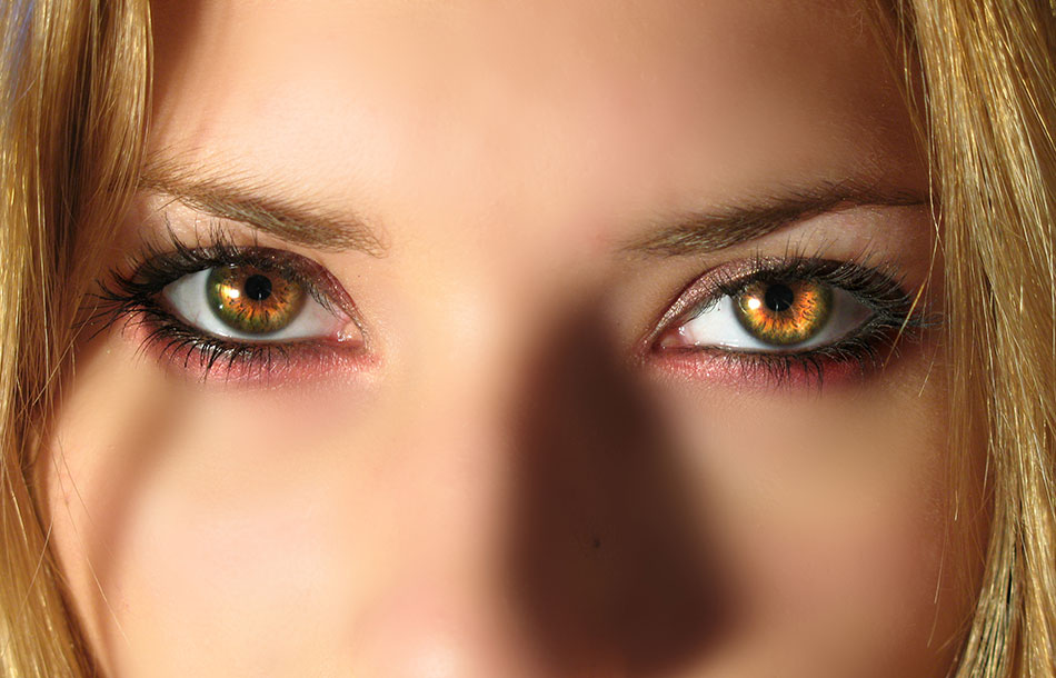 Woman wearing light-brown coloured contacts