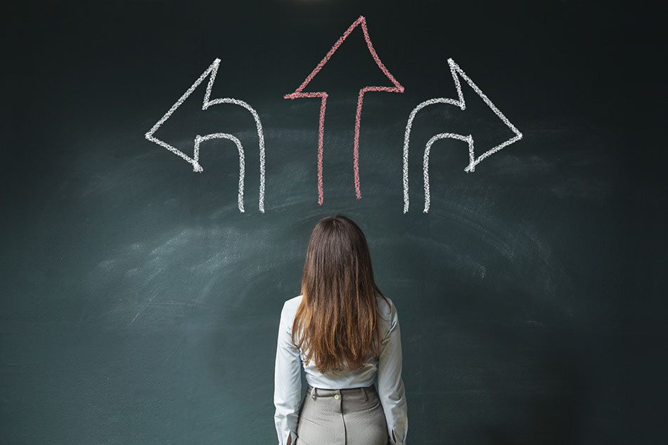 woman with 3 arrows on chalkboard