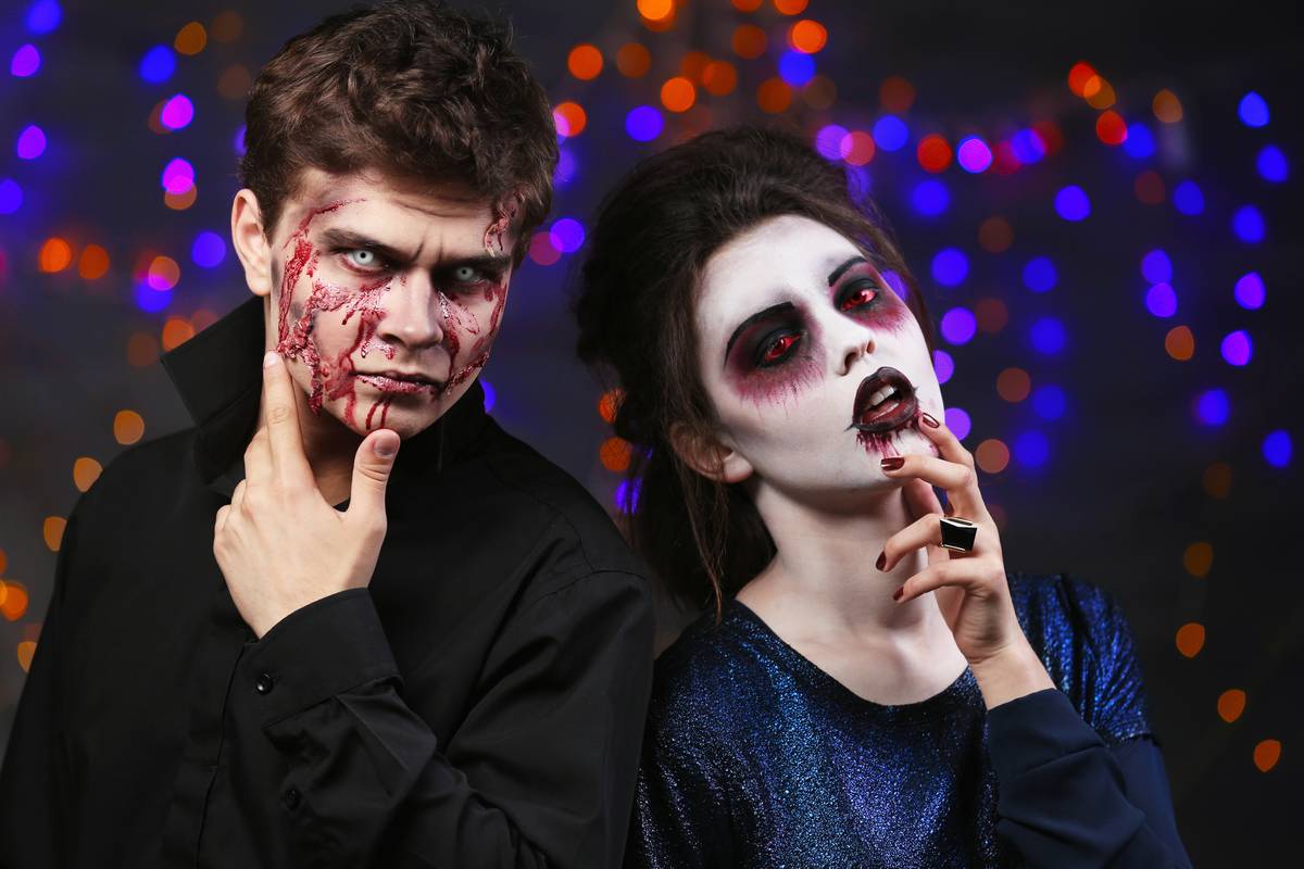 Young couple in costume with coloured contact lenses