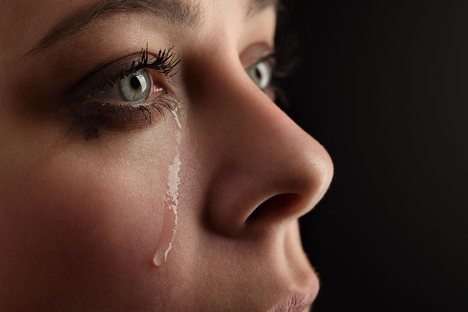 young lady crying with contacts